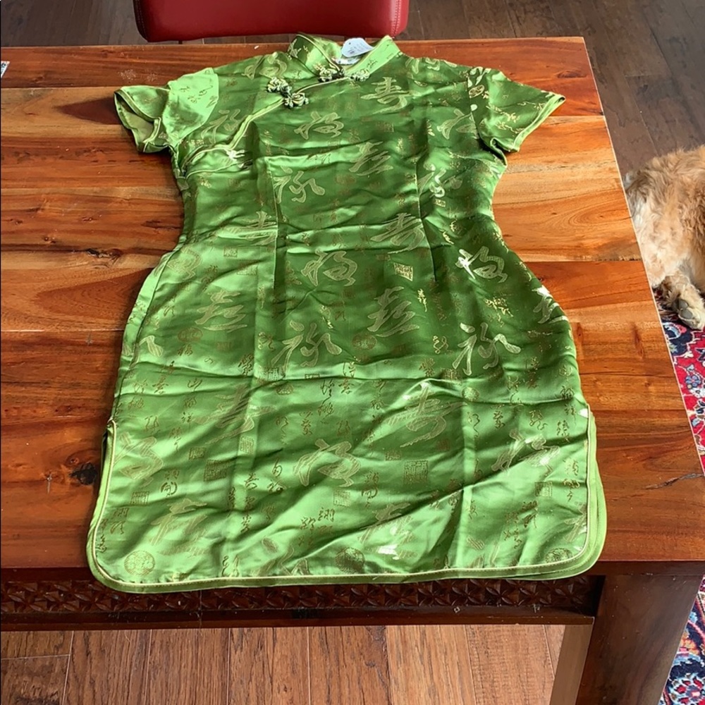Light green dress with gold Japanese writing.
